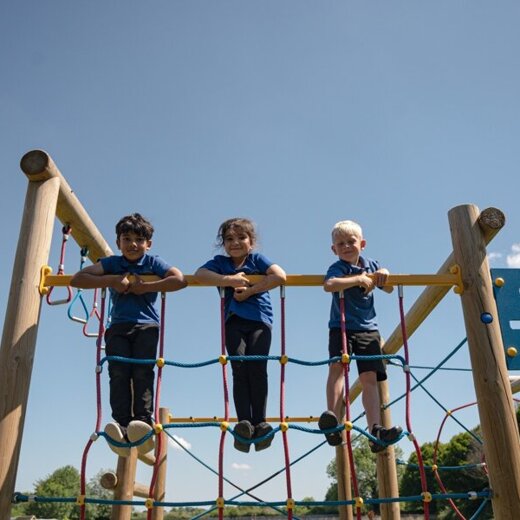 Elmhurst school students climbing structure compressed